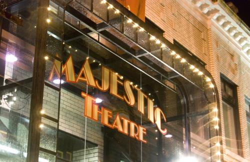 front of majestic theatre lights lit up in evening