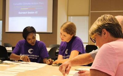 People having a discussion at a city meeting