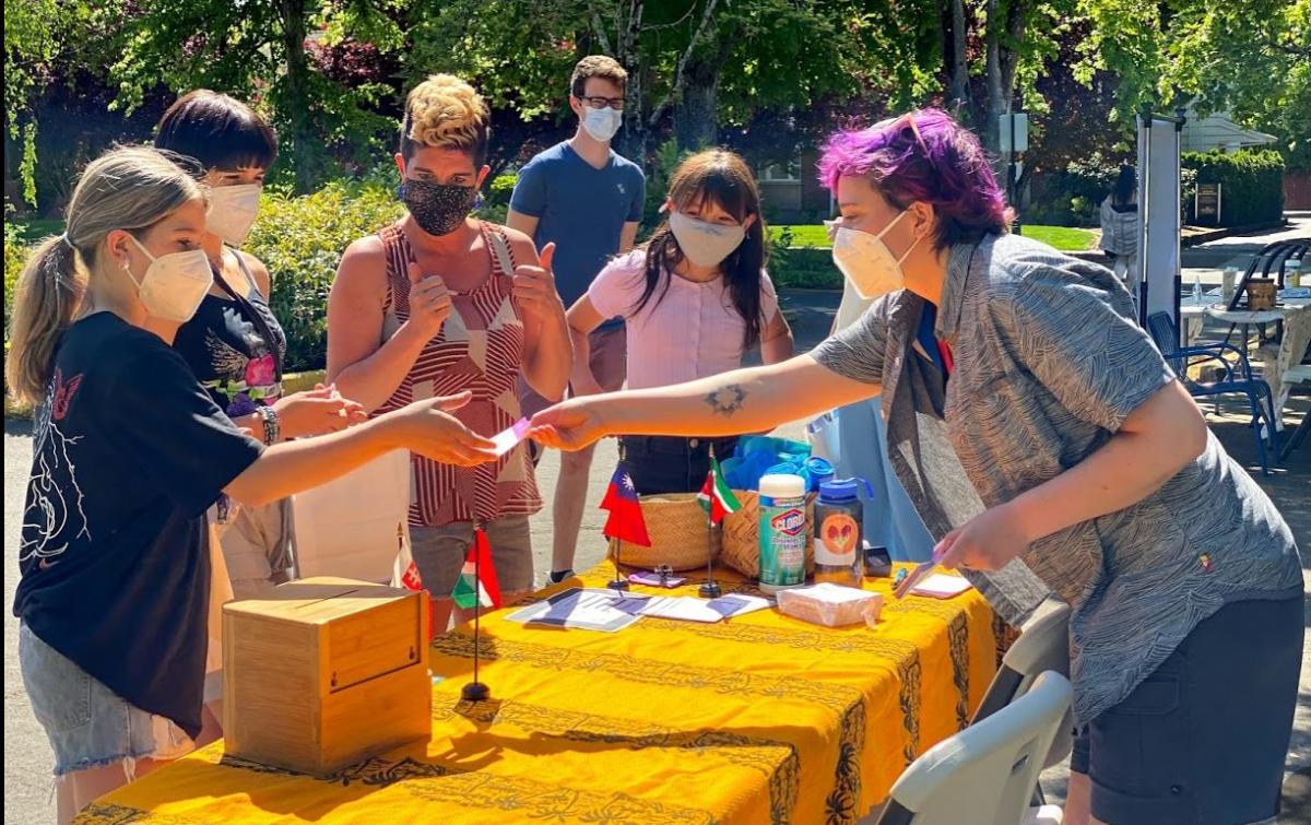 The Corvallis Multi-Cultural Literacy Center welcomes attendees to a drive/walk/bike through event hosted at the center.